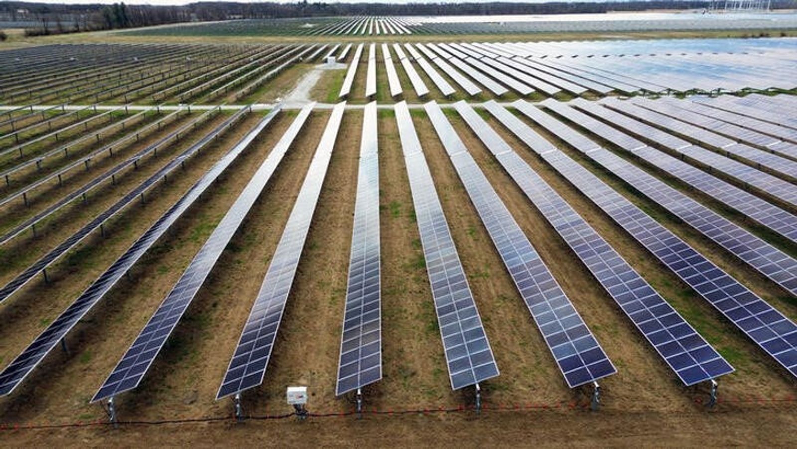 A drone view shows solar panels as they stand on Dave Duttlinger's farmland that he leased to Dunns Bridge Solar LLC in Wheatfield, Indiana, U.S., April 5, 2024.  REUTERS/Jim Vondruska