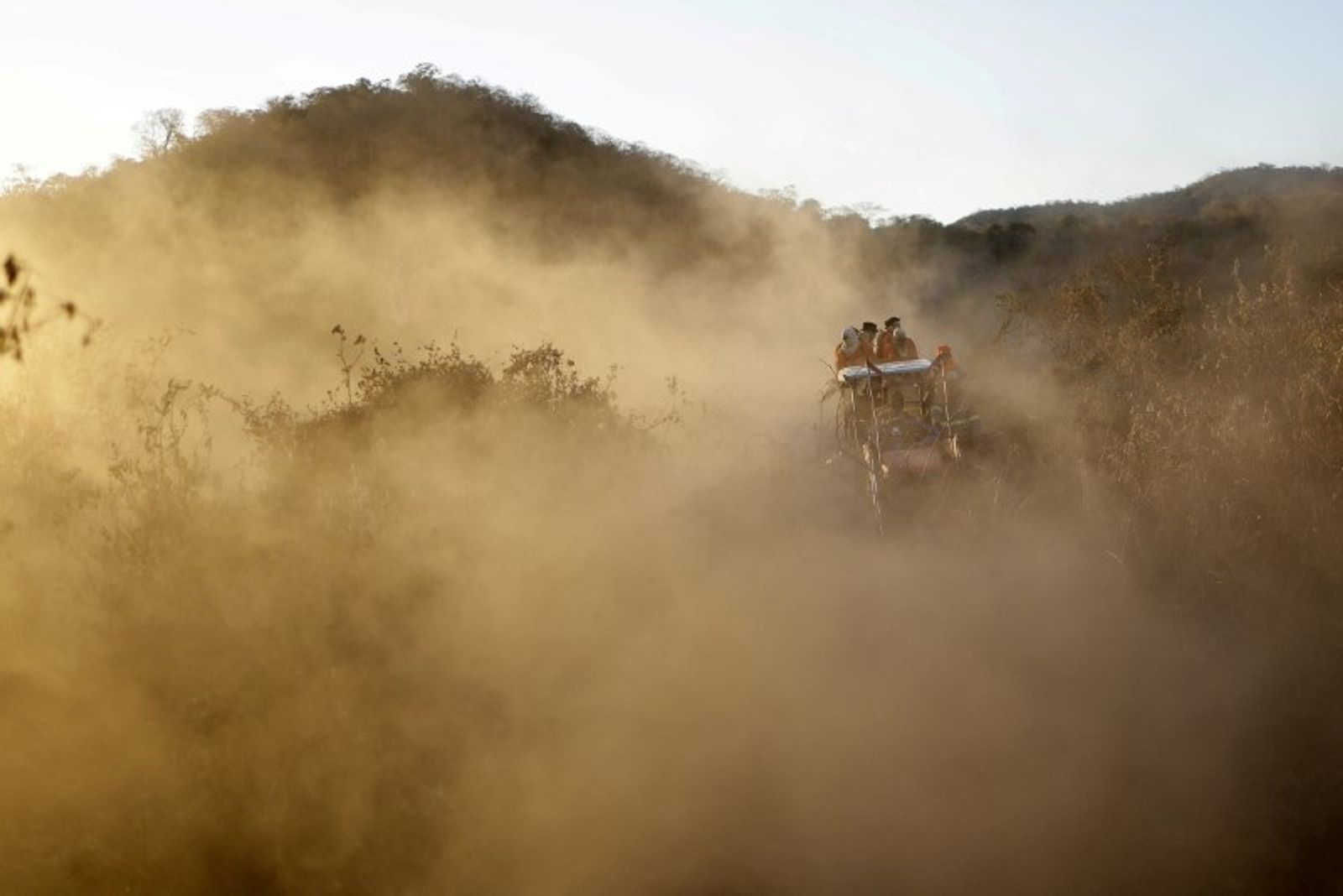 FILE PHOTO: Volunteer firefighter members of the Alto Pantanal Brigade are seen on a tractor as they work to extinguish a fire rising in the Pantanal, the world's largest wetland, in Corumba, Mato Grosso do Sul state, Brazil, June 14, 2024. REUTERS/Ueslei Marcelino/File Photo