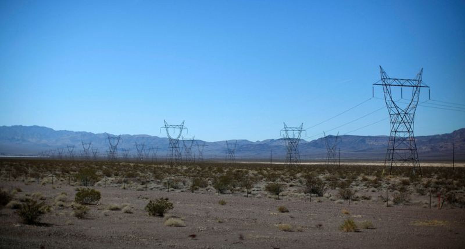 FILE PHOTO: Electricity transmission towers are seen in the Nevada desert near the Copper Mountain Solar Project, in Boulder City, Nevada March 21, 2012. REUTERS/Jason Reed/File Photo