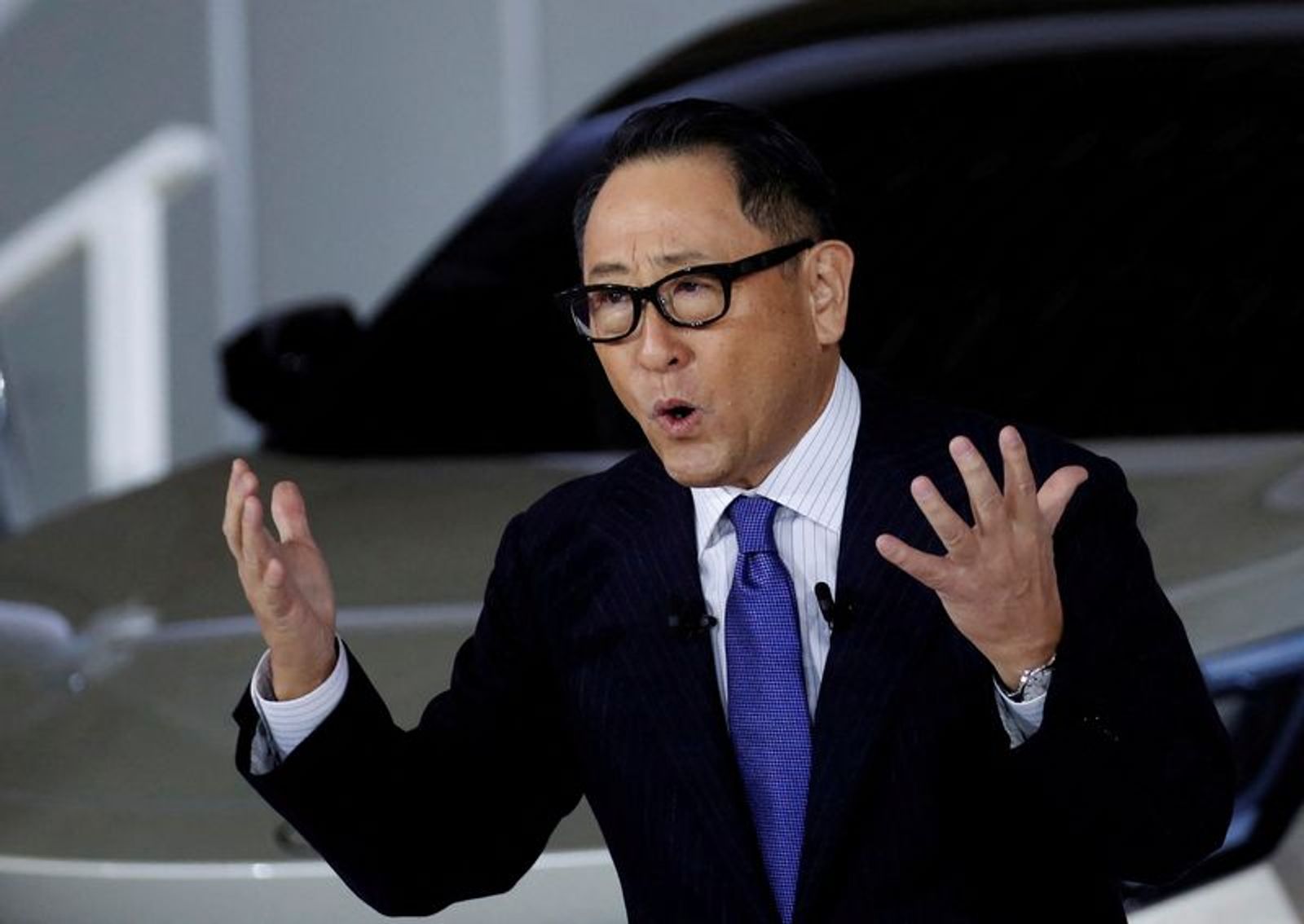 FILE PHOTO: Toyota Motor Corporation President Akio Toyoda speaks at a briefing on the company's strategies on battery EVs in Tokyo, Japan December 14, 2021. REUTERS/Kim Kyung-Hoon/File Photo